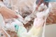 A man is taking a bath with foam on his body.